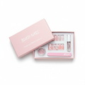 Pastel pink press-on nail art kit with floral designs